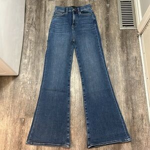 ASOS DESIGN '70s power stretch flared jeans in mid blue